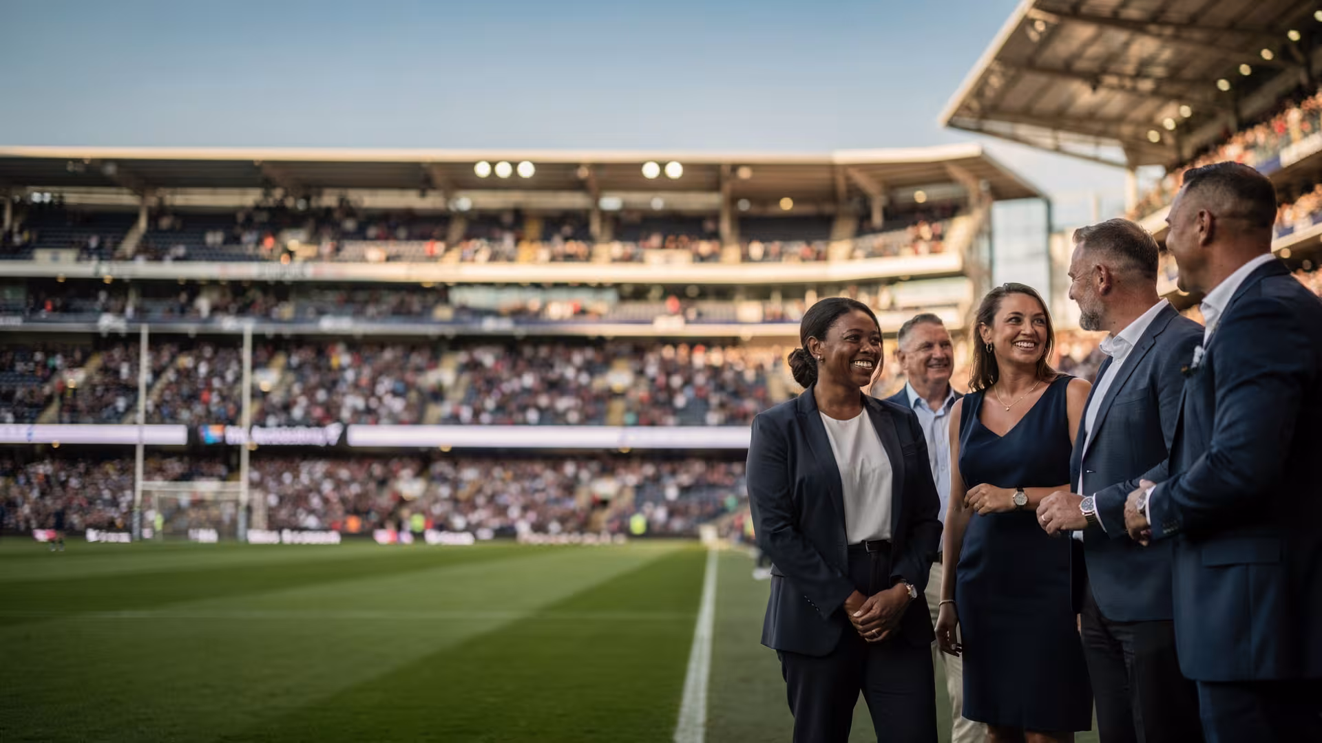 Business guests enjoying pitchside access before a rugby match