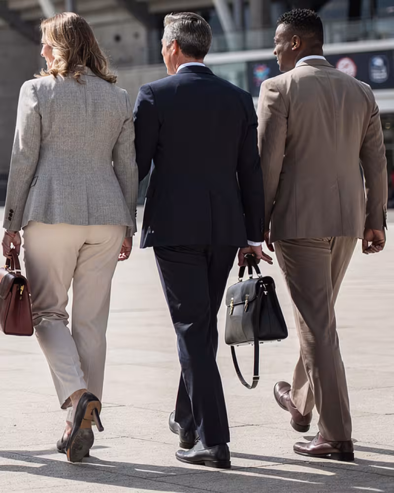 Corporate guests arriving at a modern rugby stadium