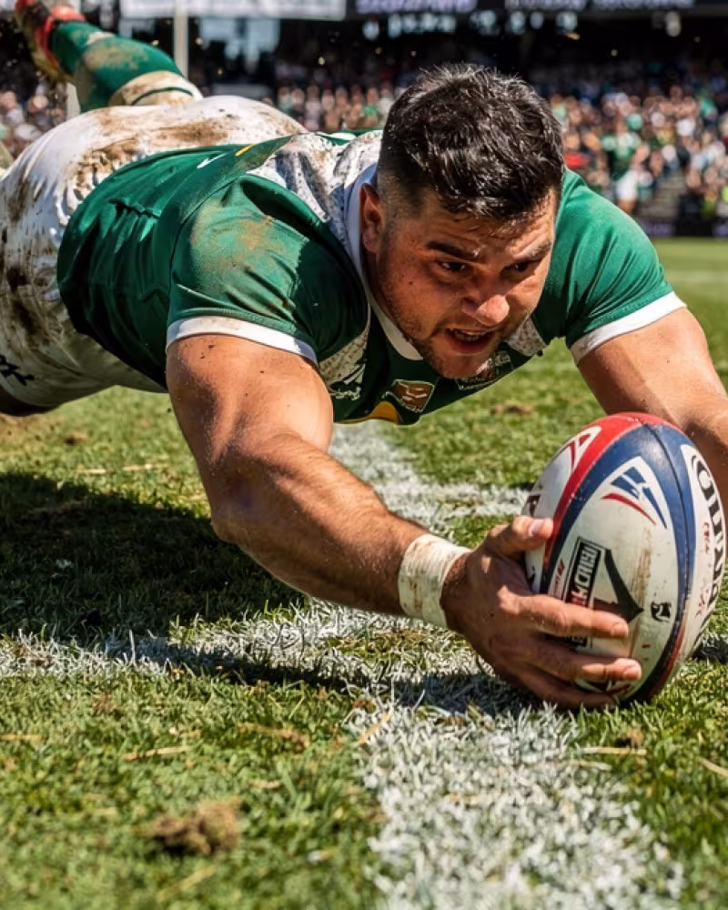 A player diving to score a try during a Gallagher Premiership match