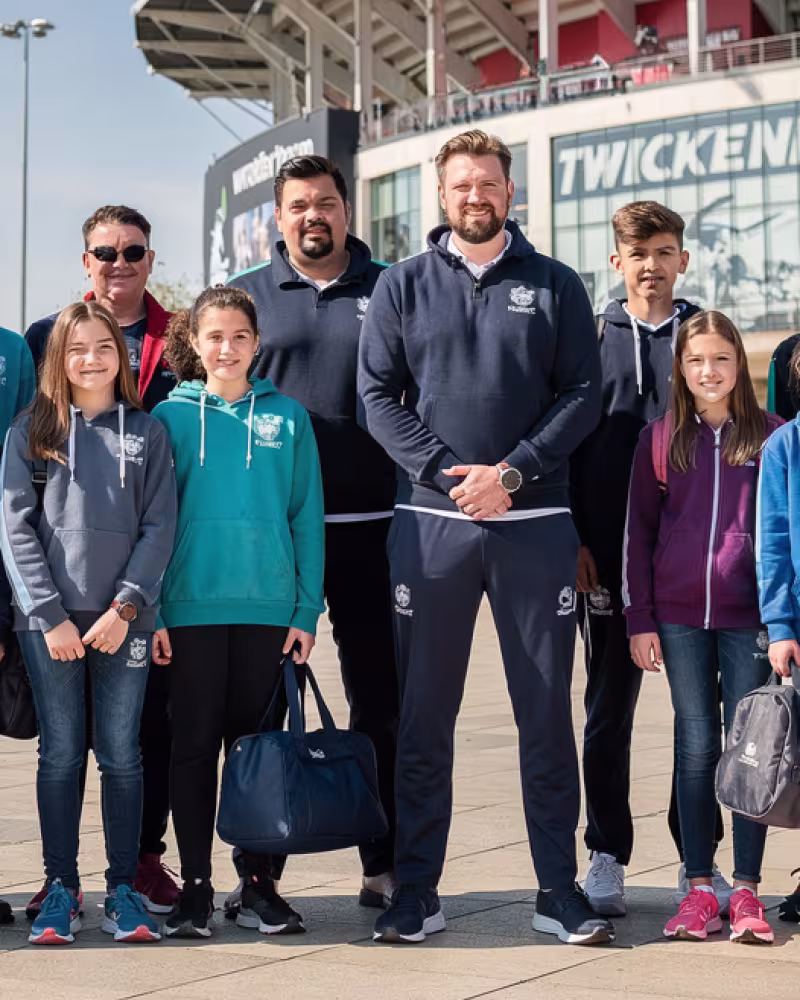 Youth rugby team, coaches and parents outside Twickenham Stadium