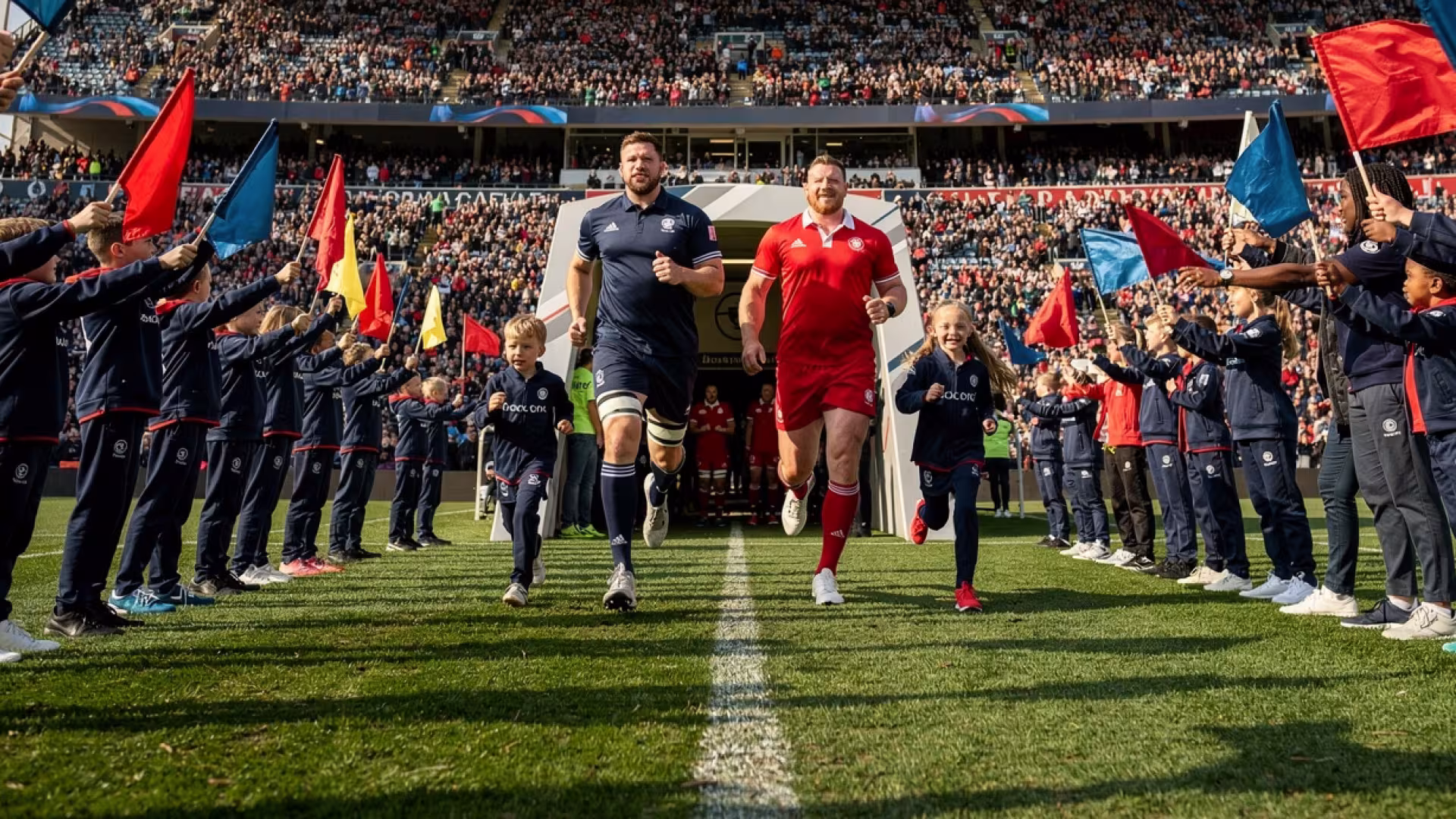 Youth flag guards and child mascots welcome rugby teams onto the pitch at Twickenham Stadium