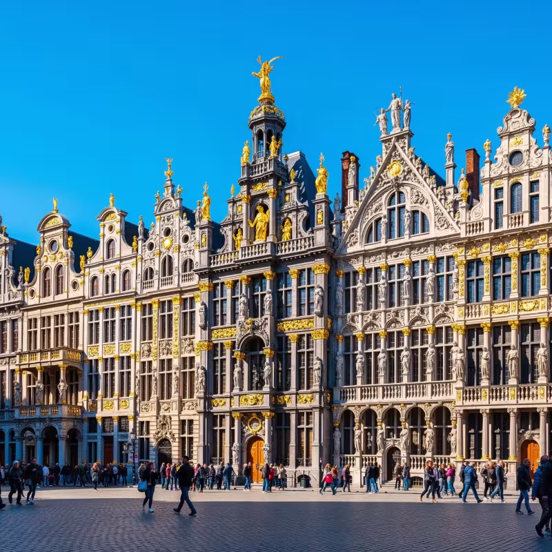 The Grand Place guild houses in Brussels, Belgium, under bright blue sky