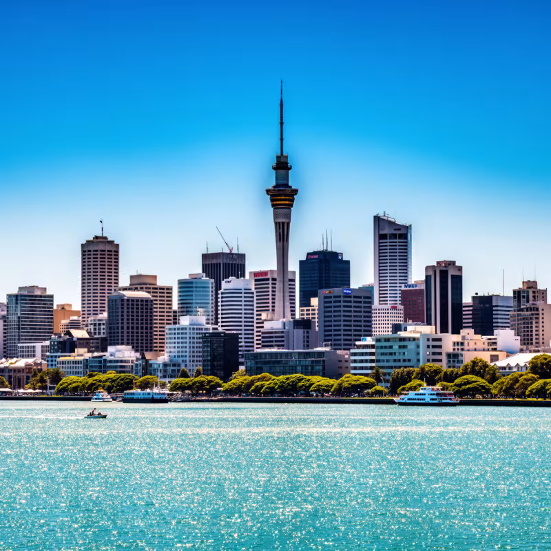 The Auckland skyline with the Sky Tower, New Zealand, under bright blue sky