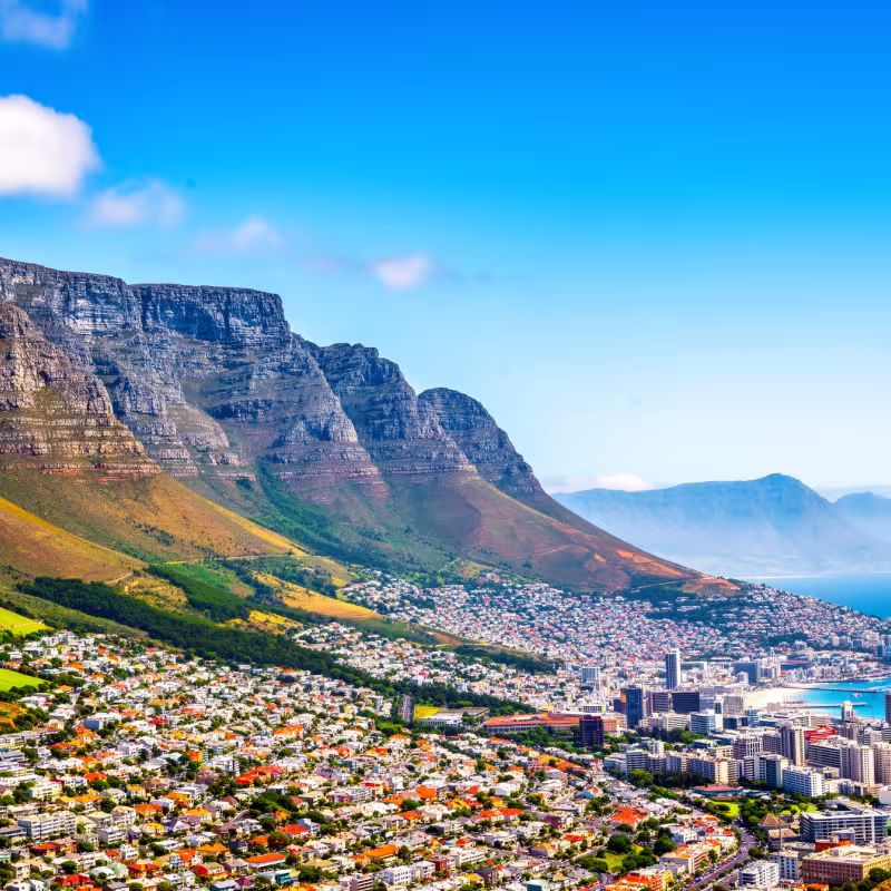 Table Mountain overlooking Cape Town, South Africa, under bright blue sky